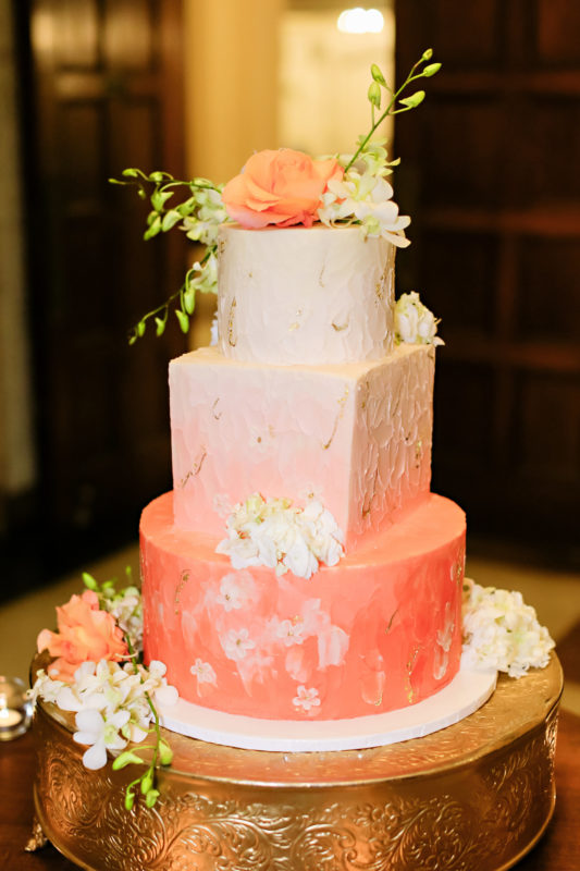 Ombre pink cake with fresh floral by Kahn's Catering