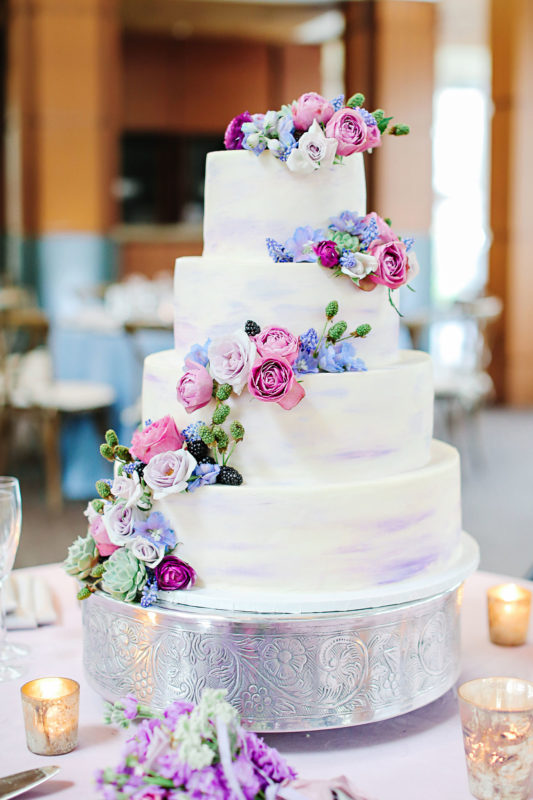 Pastel floral on butter cream wedding cake